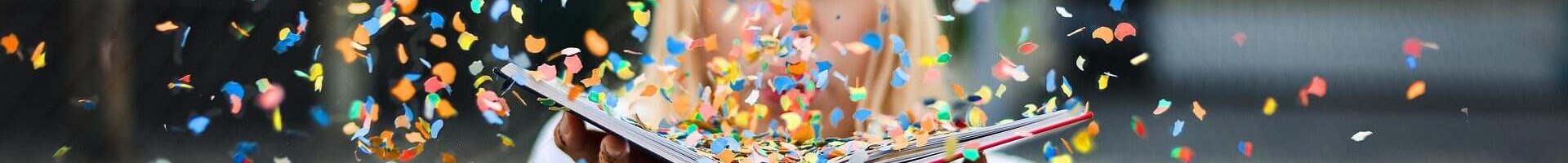 Woman blowing confetti