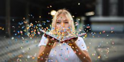 Woman blowing confetti